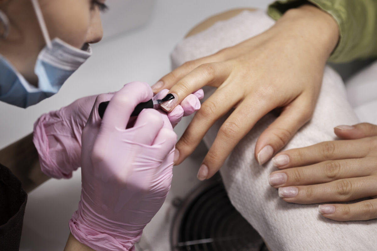 nail-art-professional-working-client-nails